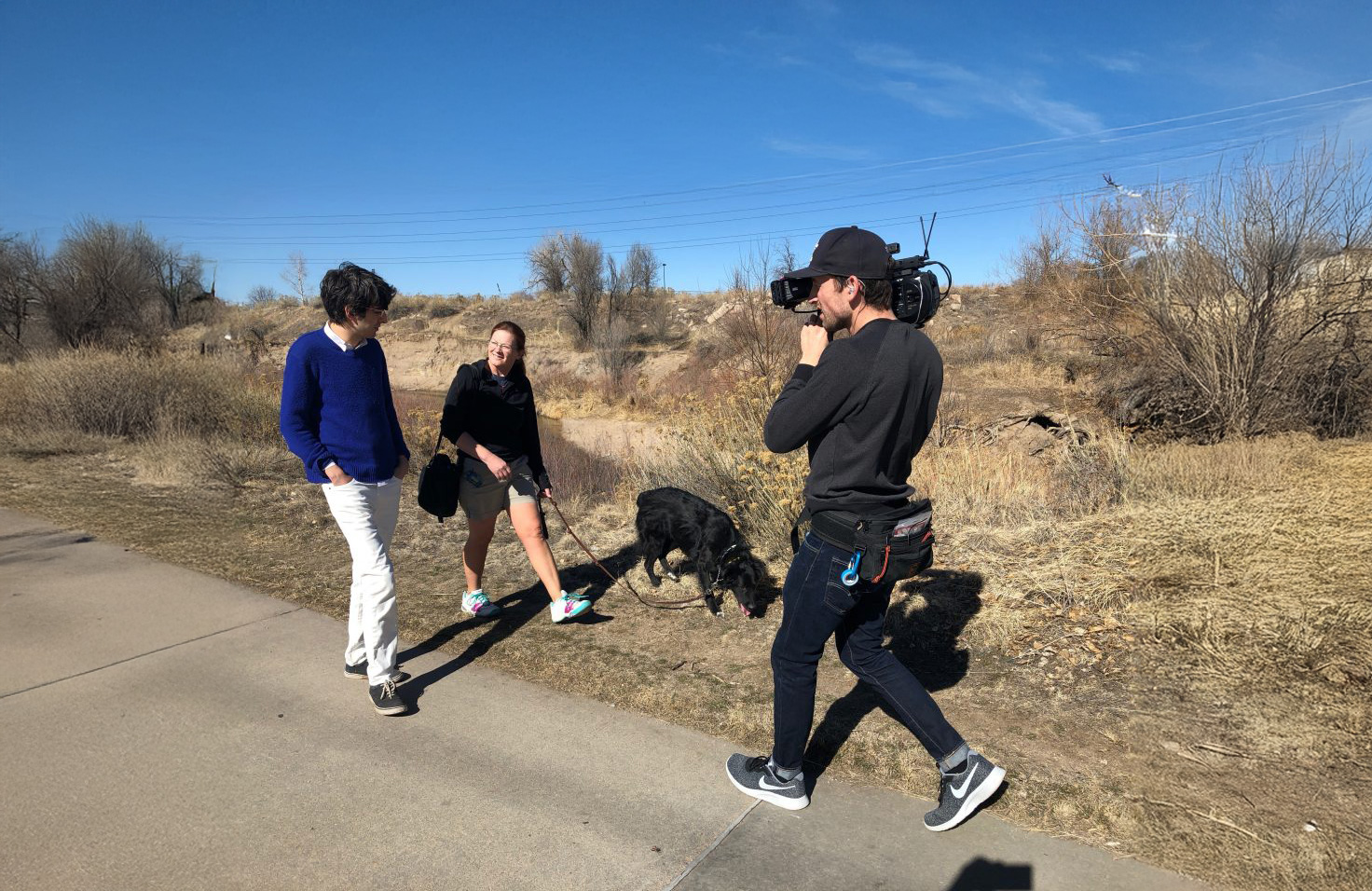 lab student examining liquid in laboratory flask