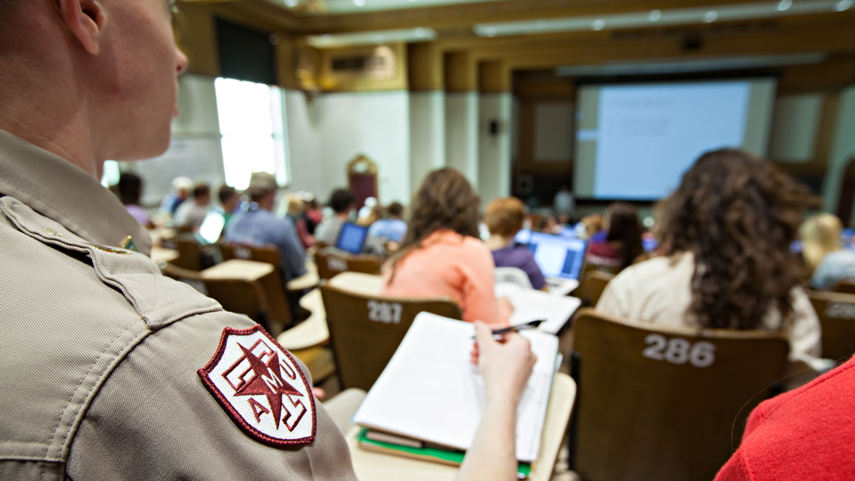 back of a chemistry classroom with students taking notes