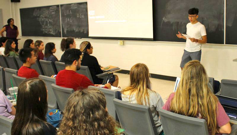 Student presenting to a bio first class.