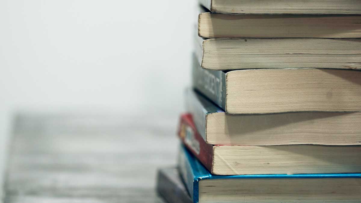 A stack of paperback books