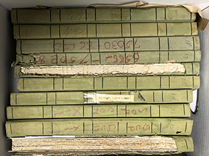 Spines of logbooks in a box