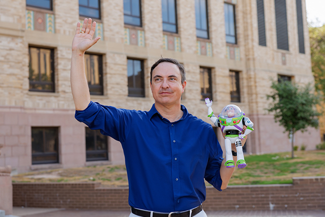 Creative Manager Grant Hawkins with Buzz Lightyear