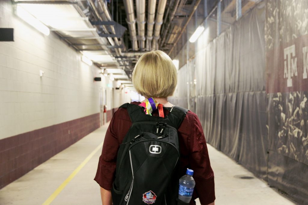 lady walking down halls of reed arena