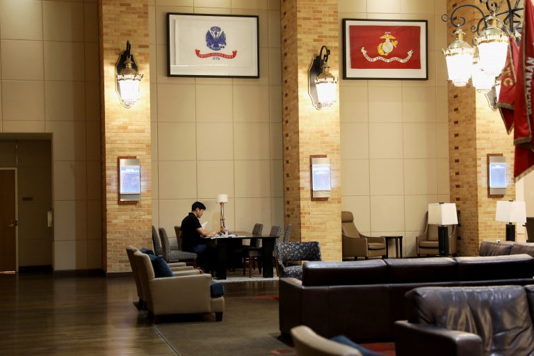 a student studies at a table in the MSC Flag Room