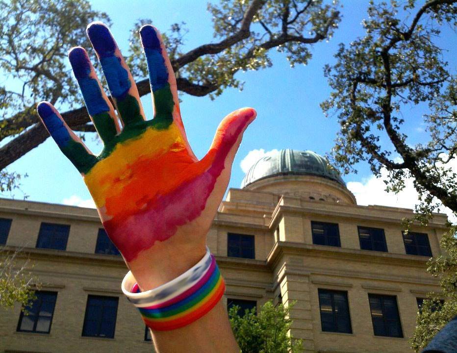 Hand painted in rainbow colors raised in front of the Academic building