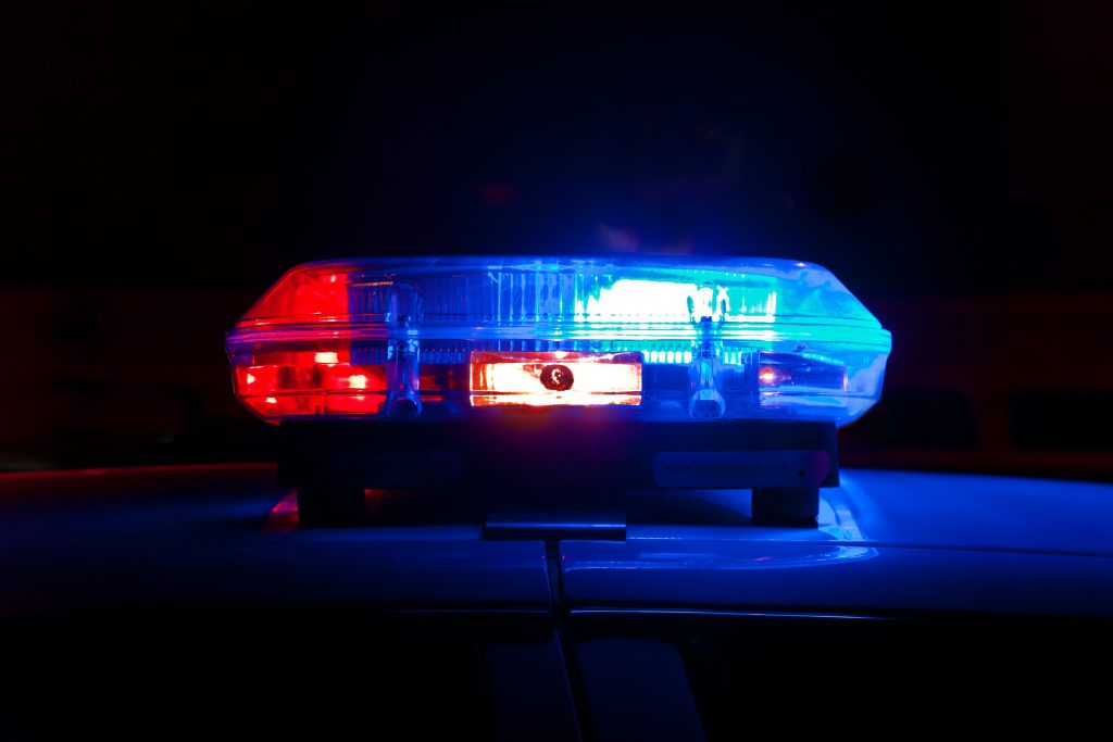 Stock image of a siren and lights lit up red and blue