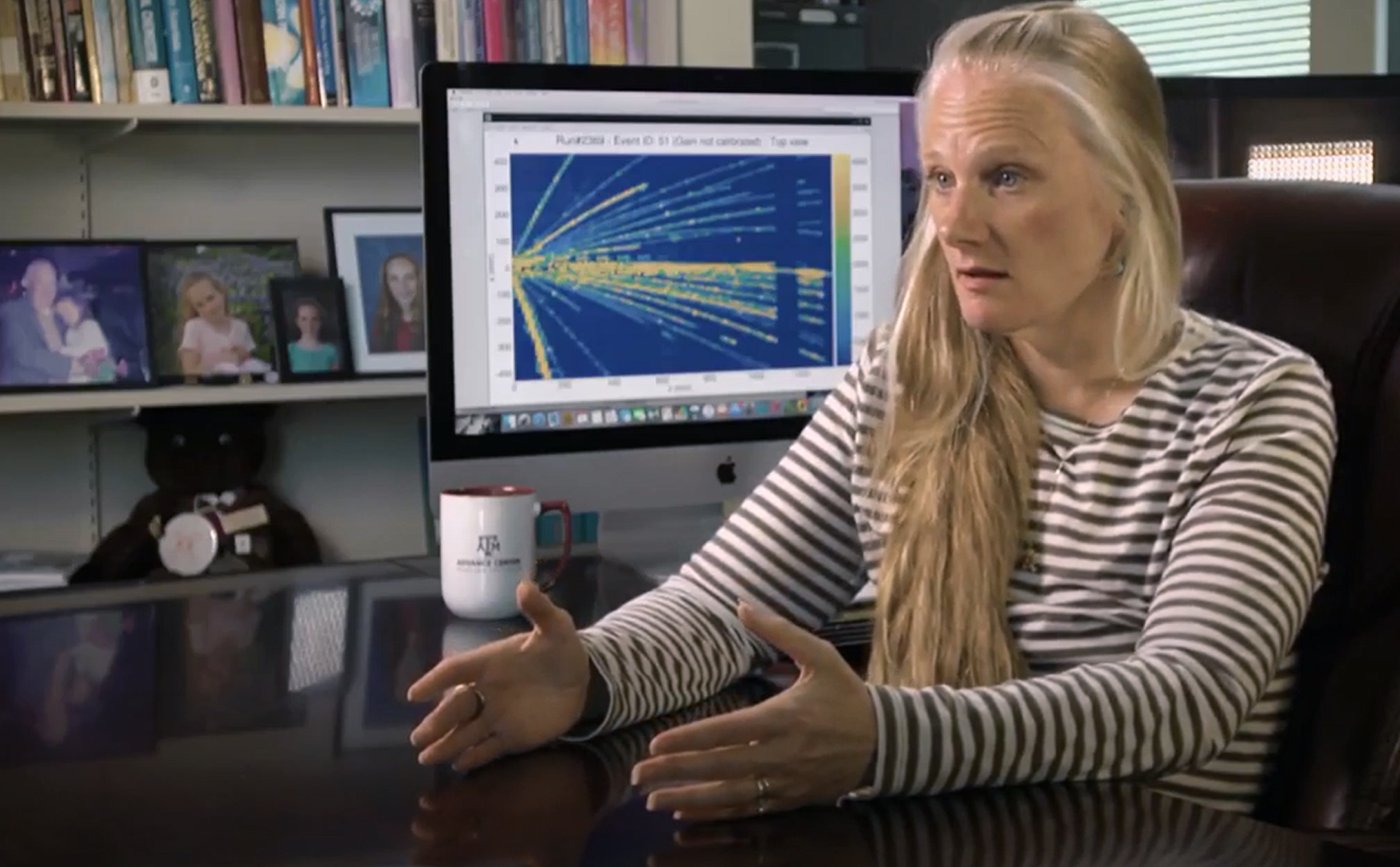 Texas A&M Distinguished Professor and Regents Professor of Chemistry Dr. Sherry Yennello explains her research from her office within the Texas A&M Cyclotron Institute