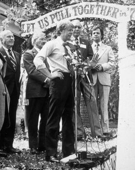 Former U.S. President Jimmy Carter speaking on stage during his presidential campaign in 1976.