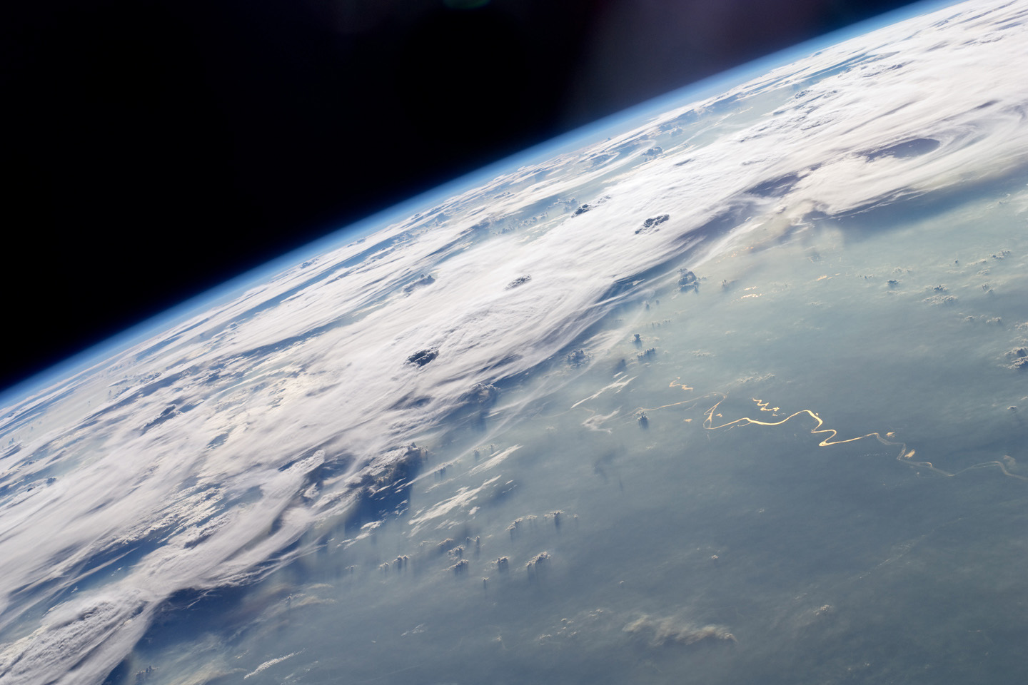 Ice clouds from thunderstorms over the Amazon Basin in an astronaut photograph taken from the International Space Station