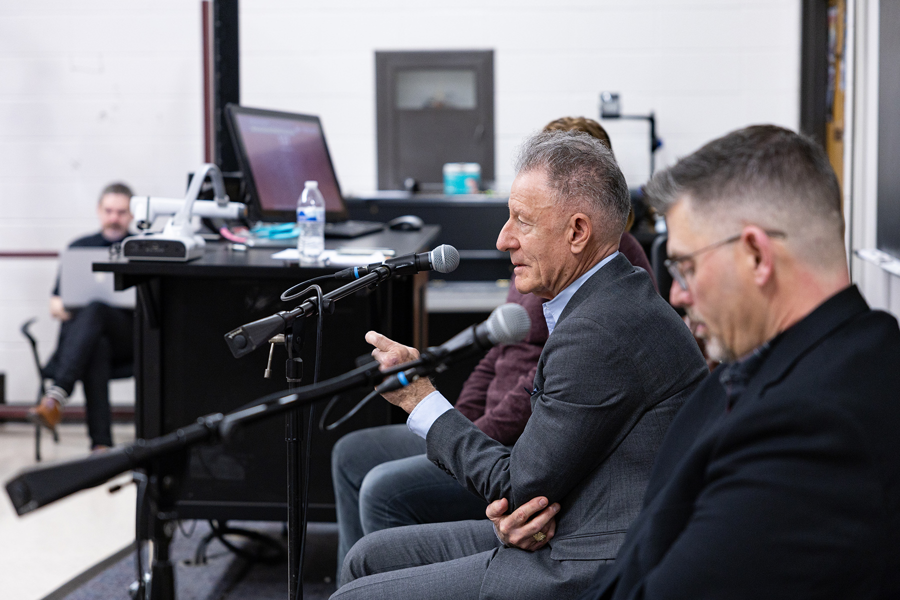 1979 Texas A&amp;M University graduate Lyle Lovett sits at the front of a classroom while speaking to a class full of undergraduates at Texas A&amp;M on Feb. 12, 2024