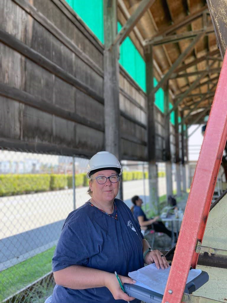 Texas A&amp;M University senior anthropology major Kimberly Price wears a hard hat and takes notes as she works on the Equator in dry dock in Everett, Washington, in 2023