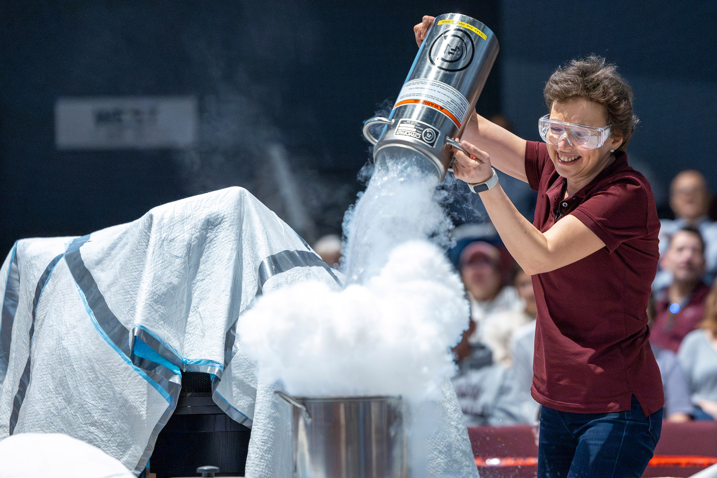 Texas A&M University physicist Tatiana Erukhimova smiles as she performs a demonstration involving liquid nitrogen at Aggieland Saturday on February 10, 2024