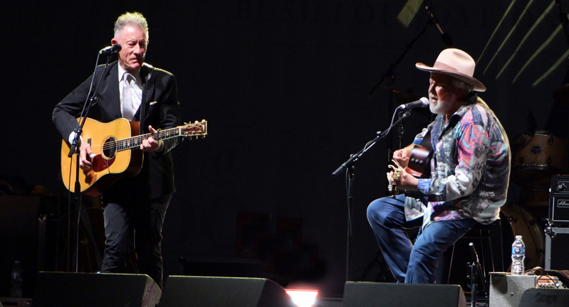 Texas A&M University former students and musicians Lyle Lovett and Robert Earl Keen perform on stage on the grounds of the George H.W. Bush Presidential Library and Museum during the Bush 41@100 Centennial Celebration on June 13, 2024