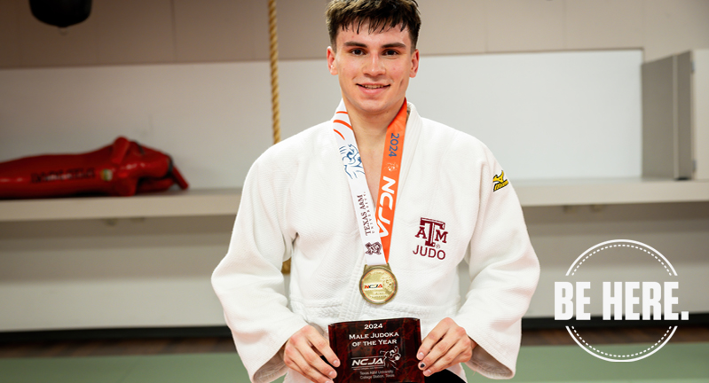 Texas A&M University applied mathematics major Paolo Maaskant poses in his judo robe with his first-place plaque