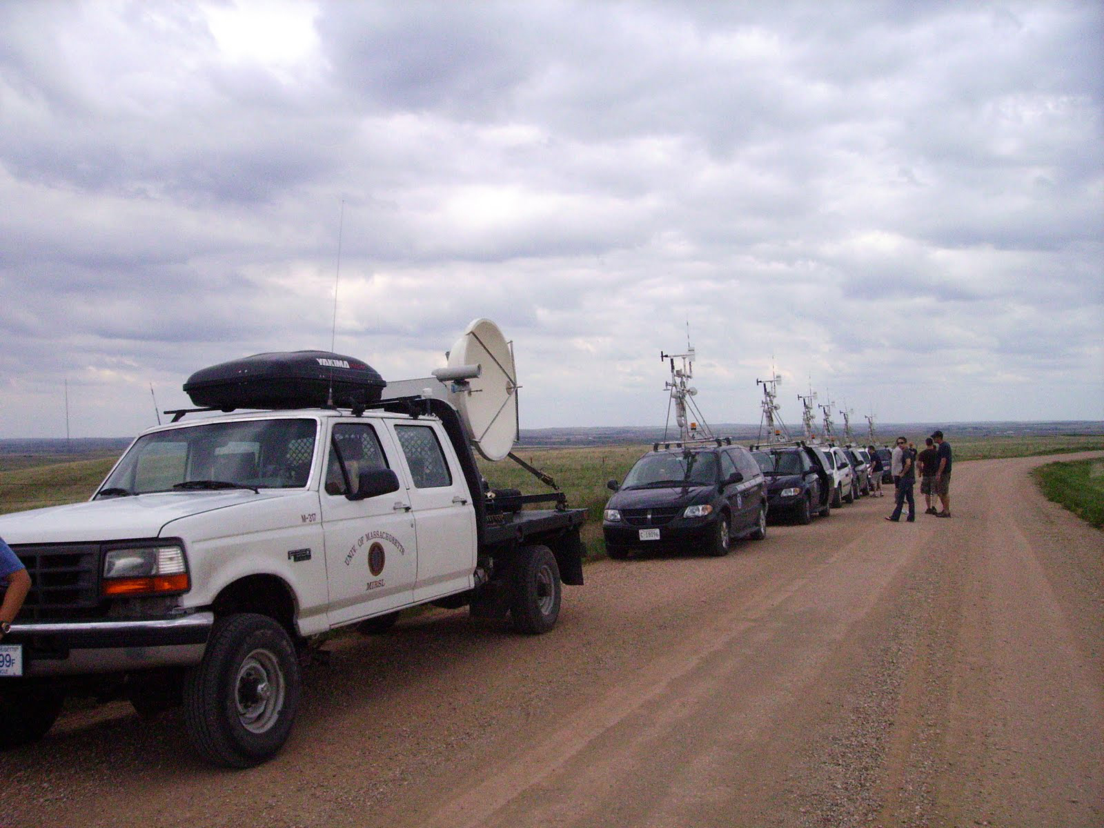 A mobile radar truck and a group of mobile mesonet vehicles awaiting deployment during the 2009 VORTEX2 field project in eastern Wyoming