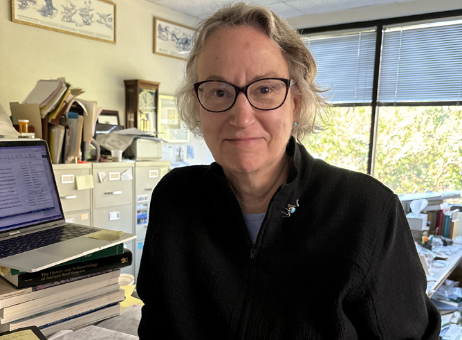 Texas A&amp;M University geologist Anne Raymond sits at her desk within her office in the Halbouty Building on the Texas A&amp;M campus