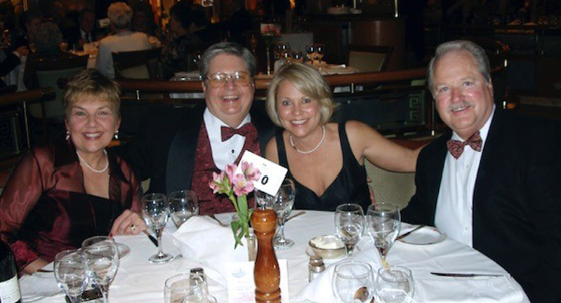 Patricia and James W. Chancellor '68 and Dana and Jon Chancellor '71, dining during a cruise in the early 2000s