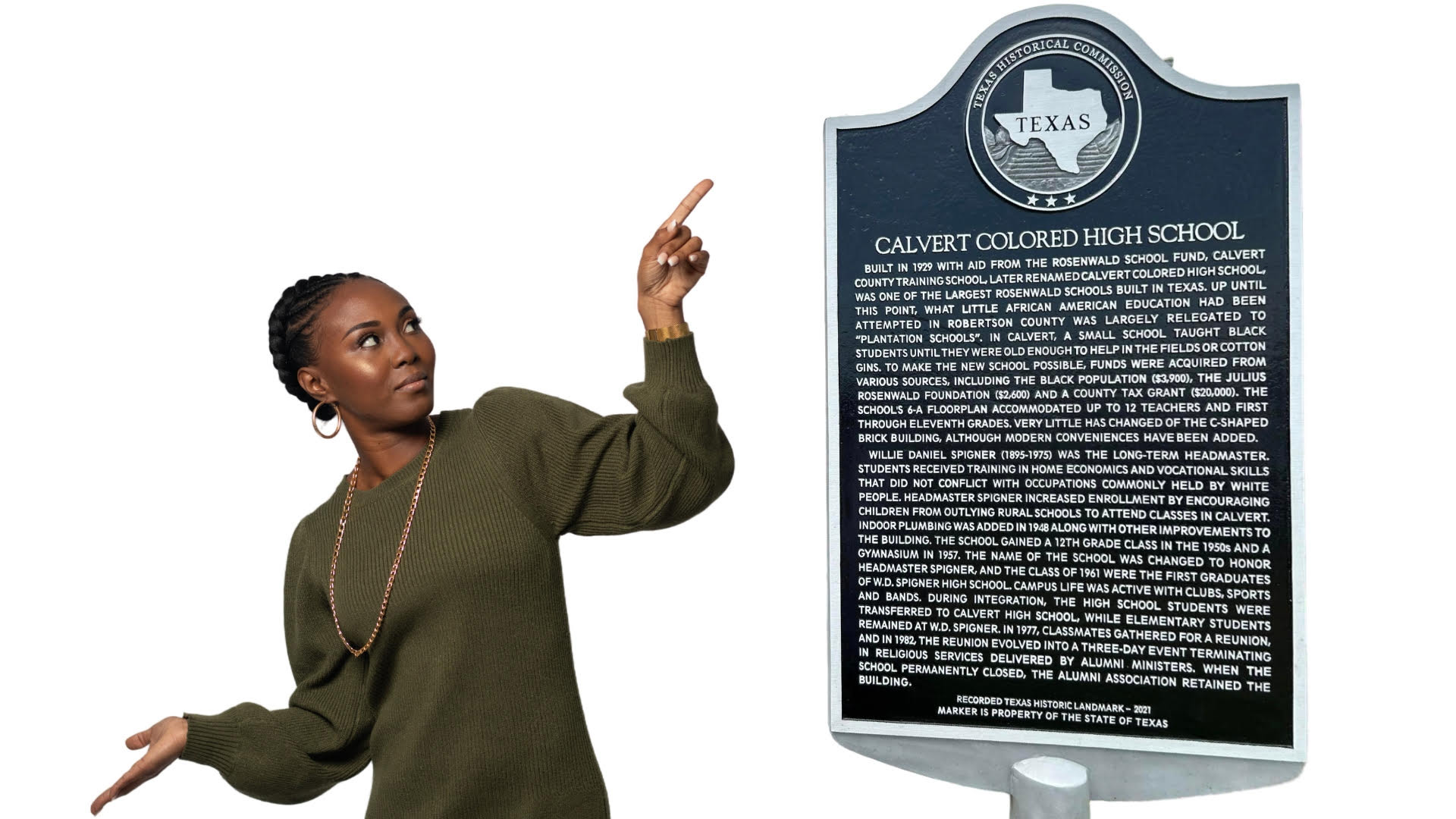 Dr. Myeshia Babers points to the historical marker she created in Calvert, Texas.