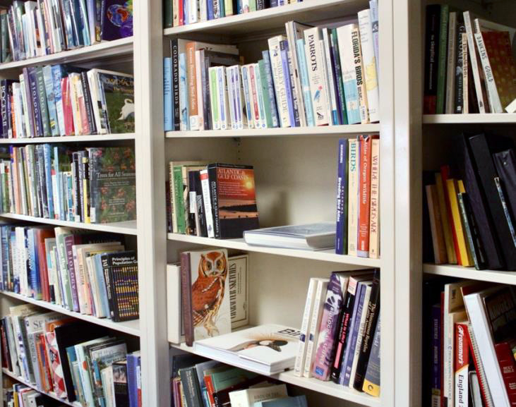 Bookshelves in Dr. Butler’s lab illustrate his passion for the study of birds and his connection with the natural world.