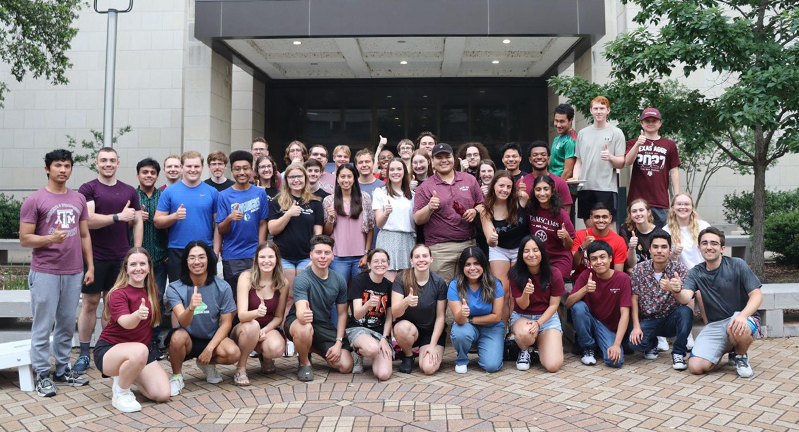 A group of TAMSCAMS students standing in front of the Oceanography and Meteorology building at Texas A&M University. The photo is from May 2024