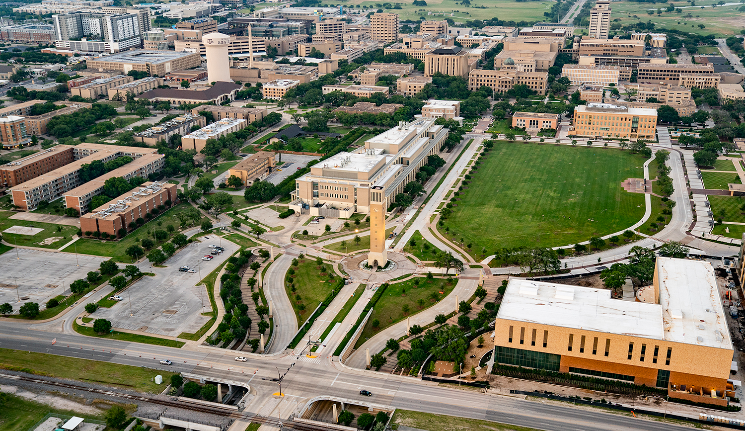 Aerial view of Texas A&amp;M University campus featuring the central green space and surrounding academic buildings.