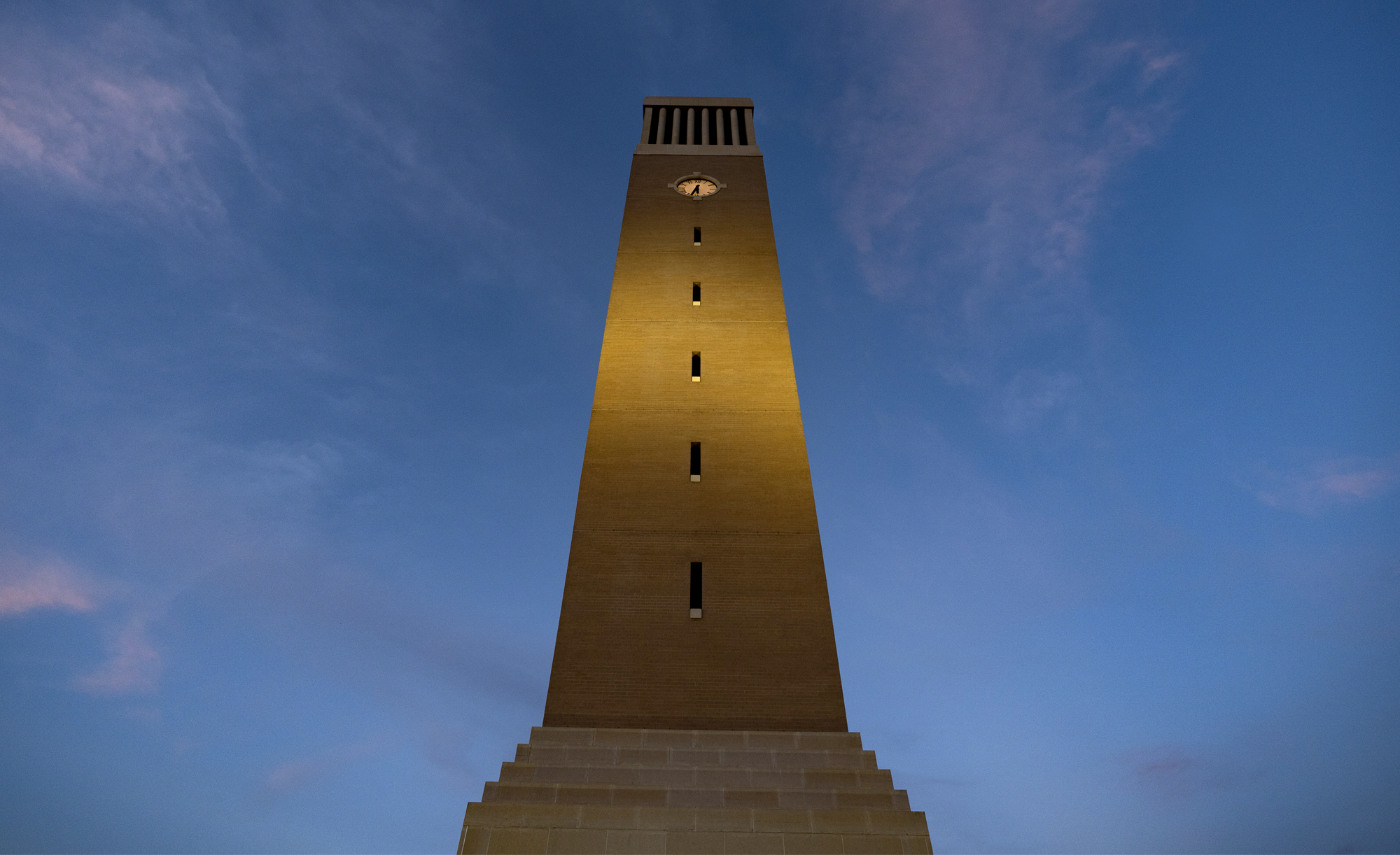 The Albritton Tower on the campus of Texas A&M at night..