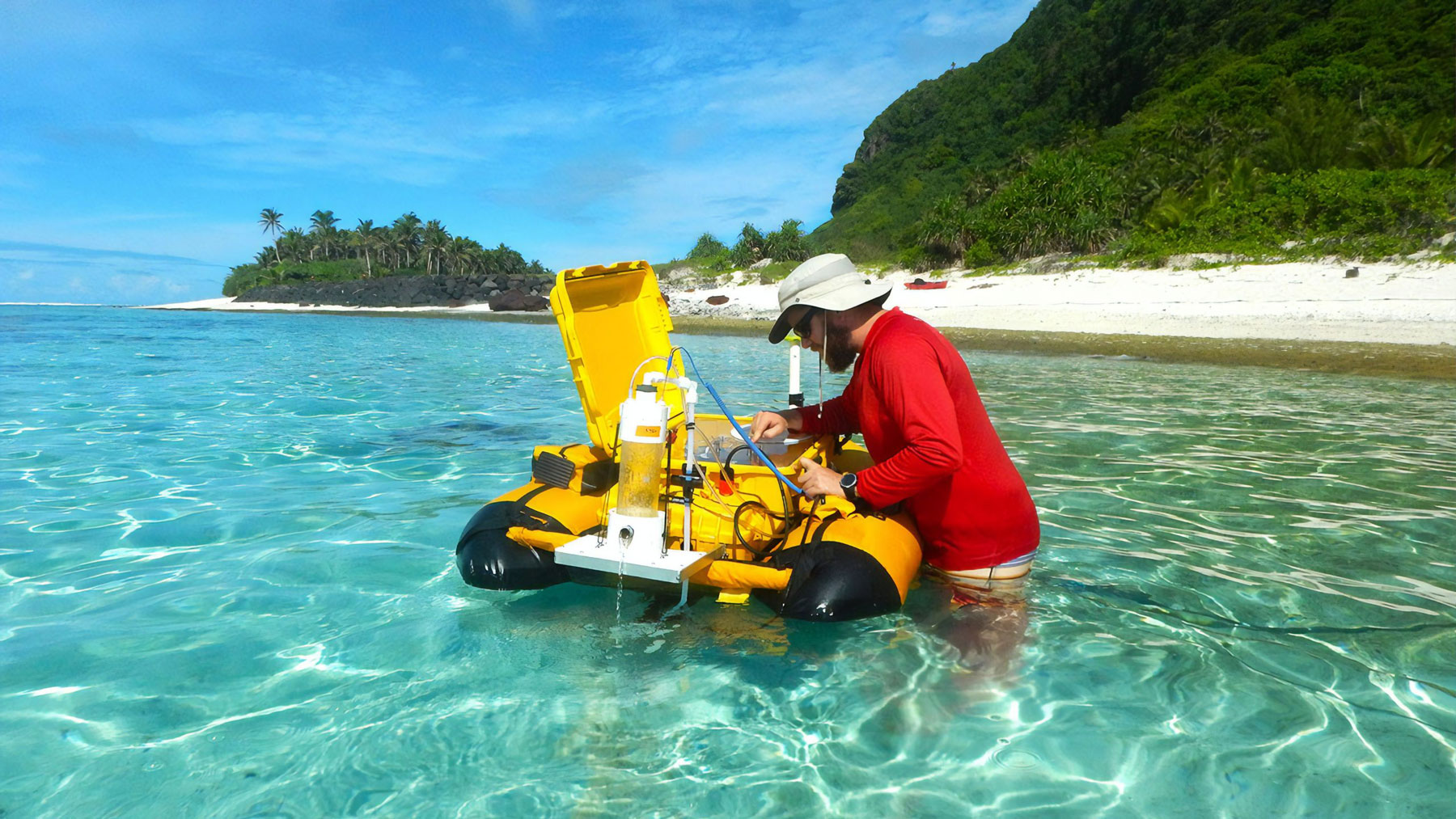 Male researcher checking on the performance of a floating research implement