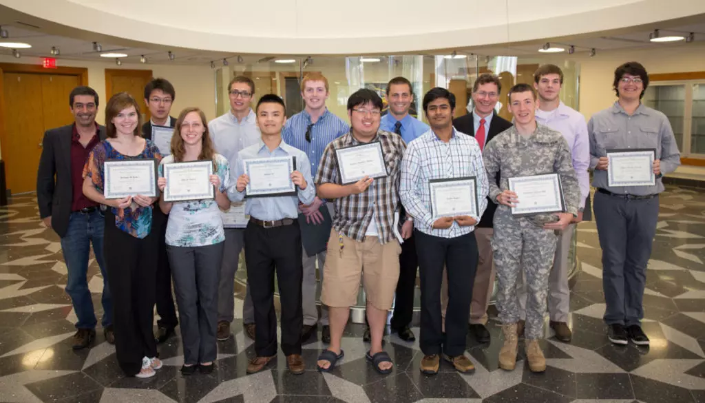 Spring 2013 Pearson Mechanics Scholars. Front row: (from left) Bethany Butler, Allyson Souris, Zhibin Ye, Yinewi "Charlie" Zhang, Tushar Rajput and Cameron Hill. Back row: Dr. Dan Melconian, Xing Zhao, Gabriel Apfel, Sam Terrill, Alex Dyson, Department Head Dr. George Welch, Jacob Lehner and Oliver Garcia. (Not pictured: Drew Spennato and Kalyn Weiss.)