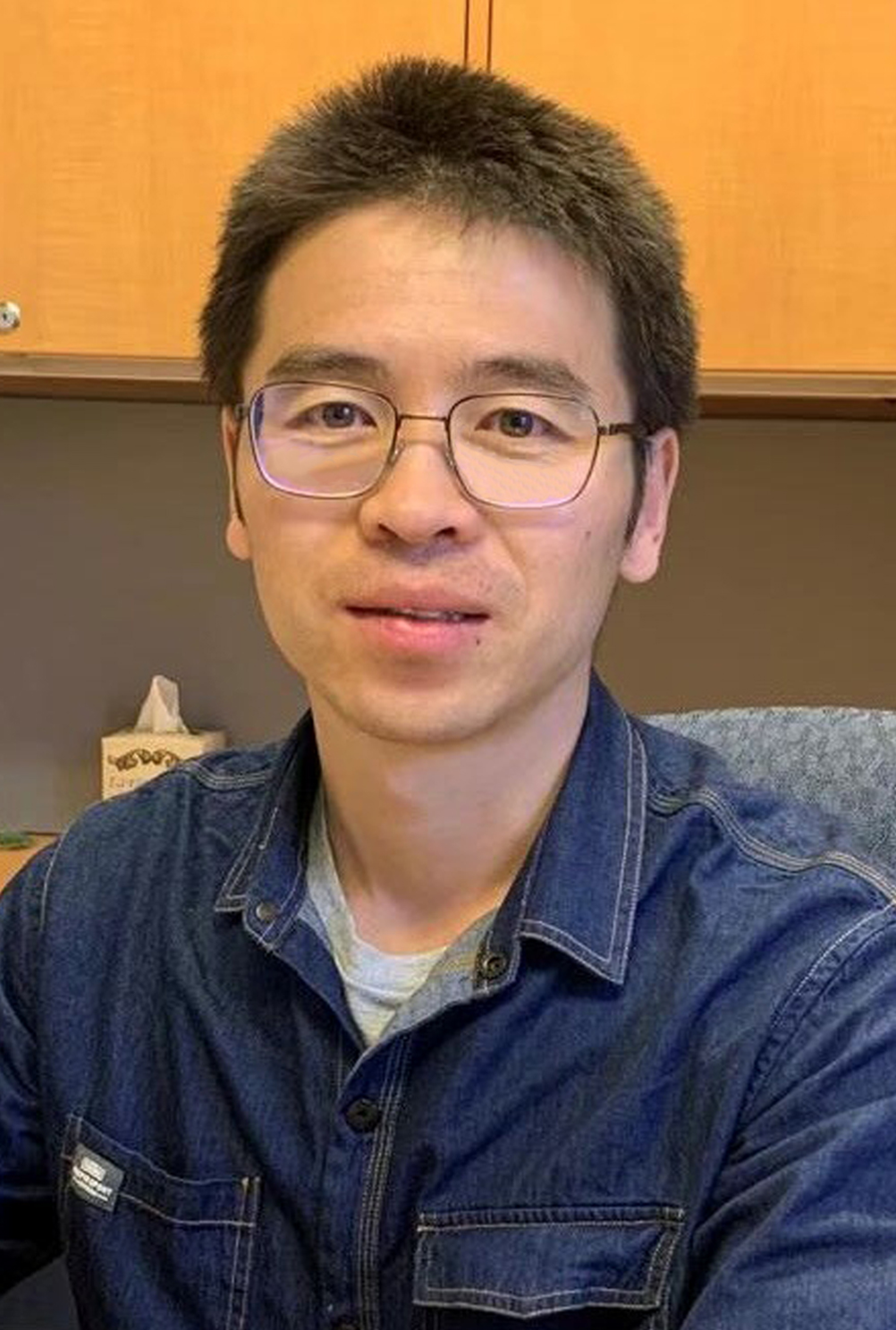 Texas A&amp;M University physicist Baishan Hu, sitting in his office within the George P. Mitchell ’40 Physics Building on the Texas A&amp;M campus.