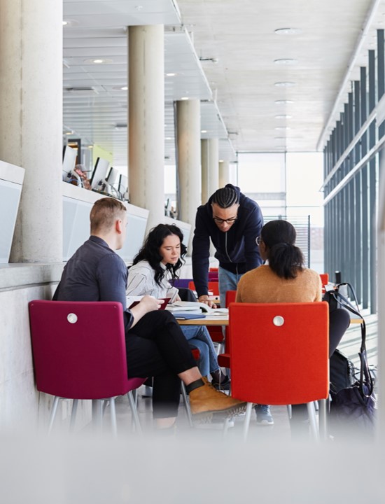 four people working around a table